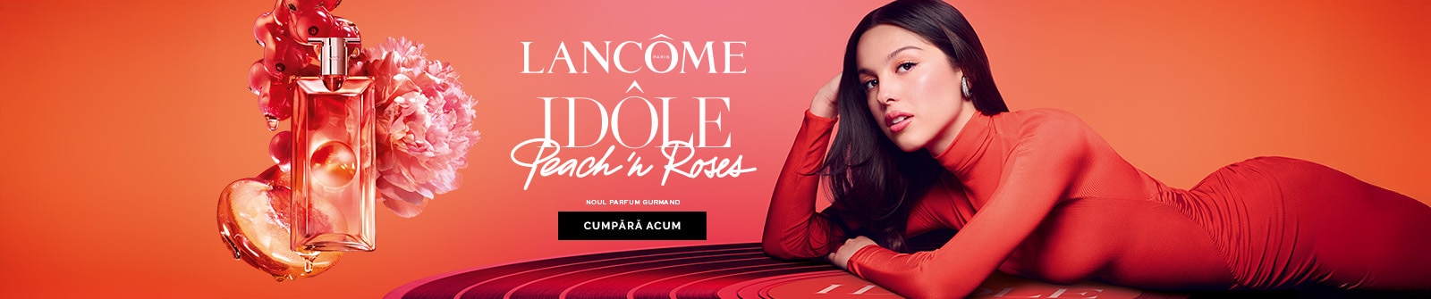 Parfum Idôle Peach in Rose Lancôme, sticlă roz și text „Cumpără acum